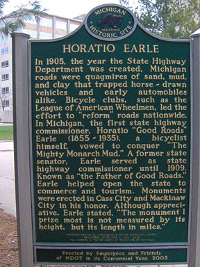 Michigan historical marker commemorating Horatio Sawyer Earle in front of the Michigan Department of Transportation building in Lansing, Michigan. width=